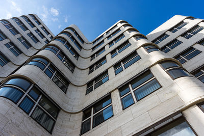 Low angle view of building against blue sky