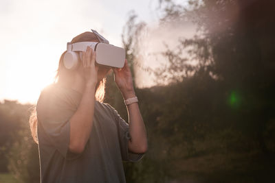 Midsection of man holding camera