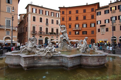 Statue in front of building