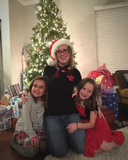 Portrait of happy family sitting on sofa at home