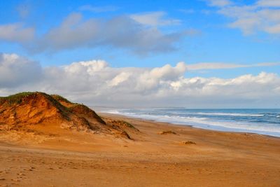 Scenic view of beach against sky