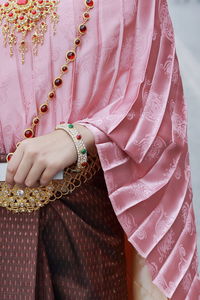 Midsection of woman wearing sari