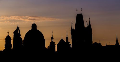 Silhouette cathedral against sky during sunset