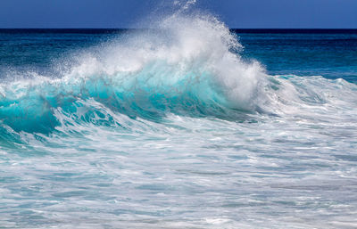 Waves breaking against sea