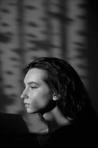 Portrait of young woman looking away