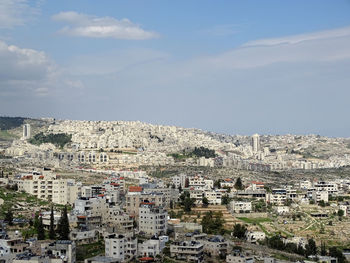 Aerial view of cityscape against sky