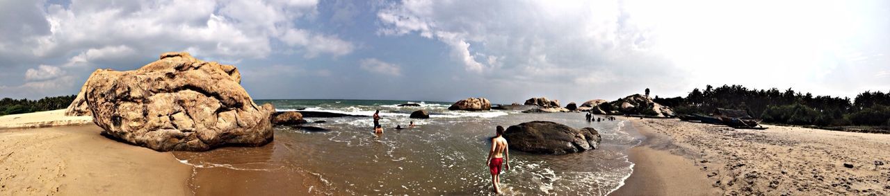 water, sea, beach, sky, shore, scenics, sand, horizon over water, rock - object, beauty in nature, tranquil scene, tranquility, nature, panoramic, rock formation, cloud - sky, sunlight, cloud, coastline, idyllic