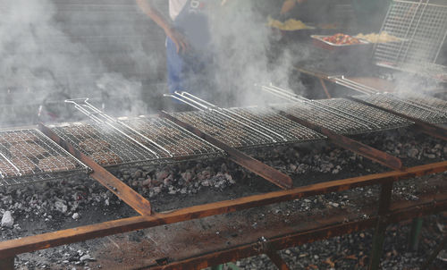 High angle view of meat on barbecue grill