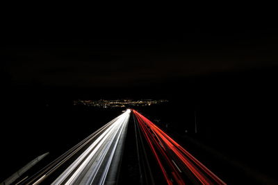 High angle view of light trails on highway at night