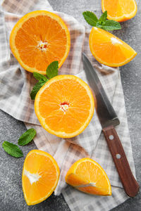 Fresh ripe oranges on dark concrete background