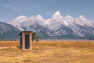 Mormon row historic district at grand teton national park. beautiful mountain background.