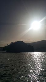 Scenic view of lake and mountains during sunset