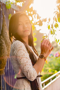 Portrait of young woman looking at camera