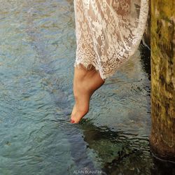 Low section of woman in swimming pool