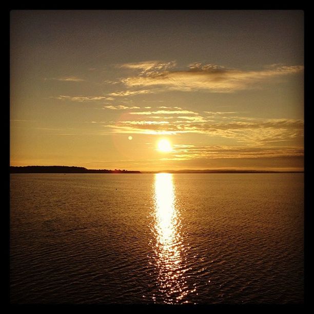 SUNSET OVER CALM SEA