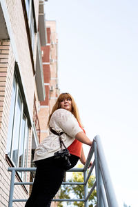 Travel, tourism and entertainment. plus size woman photographer working at the street