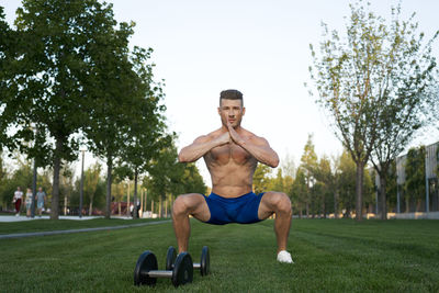 Full length of man exercising in park