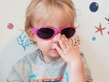 Close-up of baby girl wearing sunglasses