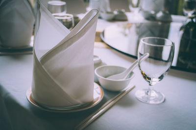 Close-up of wine glasses on table in restaurant