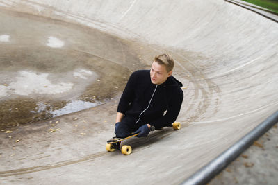 Handicapped man on skateboard