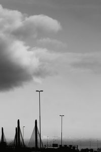 Low angle view of silhouette buildings against sky