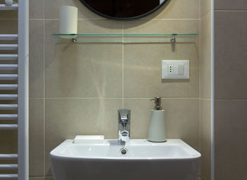 Close-up of faucet in bathroom