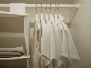 Close-up of clothes hanging in rack