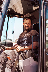 Portrait of man working at bus