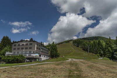 Panoramic shot of trees and buildings against sky