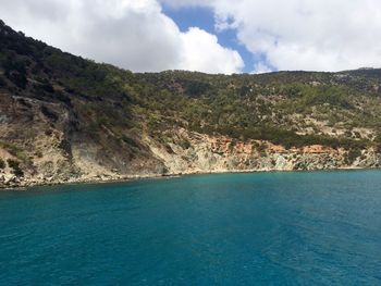 Scenic view of sea against cloudy sky