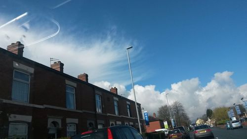 Low angle view of road against cloudy sky