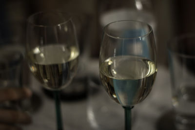 Close-up of wine glasses on table