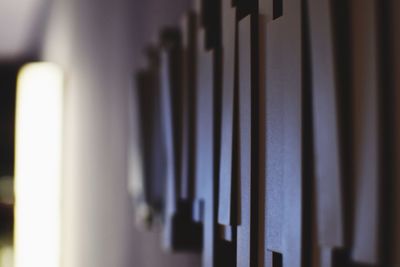 Close-up of piano hanging on wall