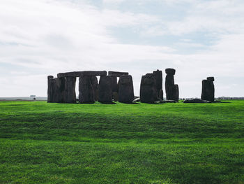 Built structure on field against sky