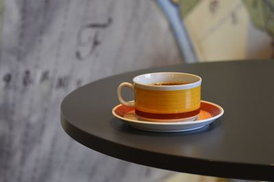 Close-up of coffee cup on table