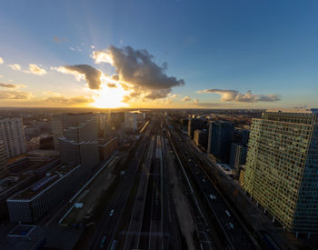 High angle view of illuminated cityscape against sky during sunset