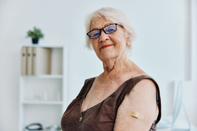 Portrait of woman wearing hat at home