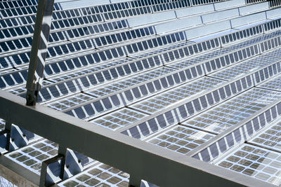 Detail view on metal and glass roof construction with solar panels