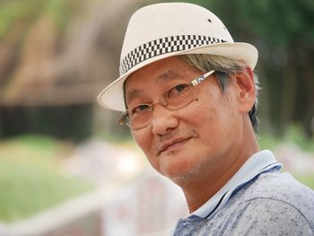 Close-up portrait of man wearing hat