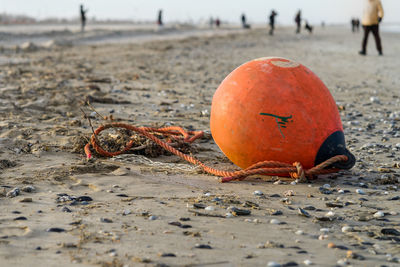 An old buoy abandoned on the beach
