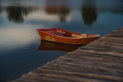 Fishing boat moored in lake