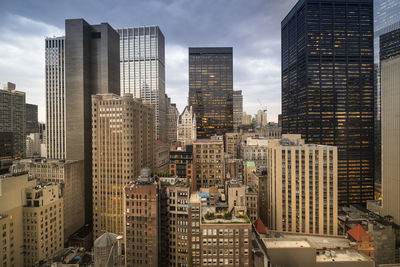 Modern buildings in city against sky