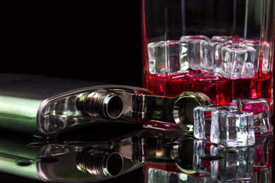 Close-up of wine glasses on table