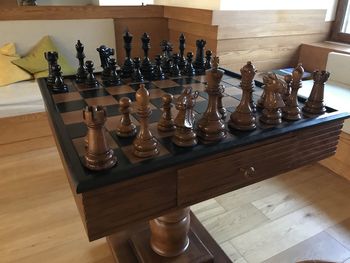 Row of chess pieces on table