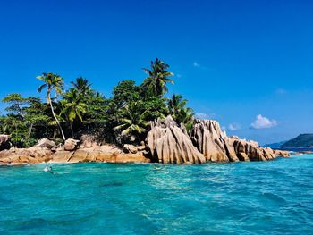 Scenic view of sea against blue sky