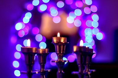 Close-up of tea light candles on table