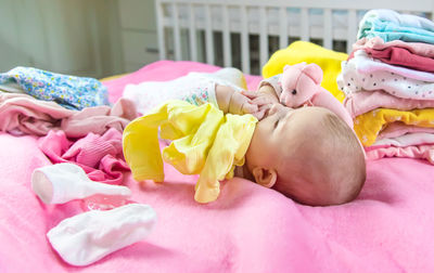 High angle view of baby boy sleeping on bed