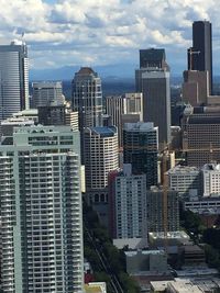 Modern buildings in city against sky