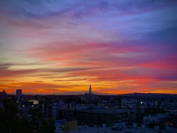 High angle view of city at sunset