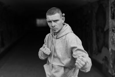 Portrait of young man standing outdoors